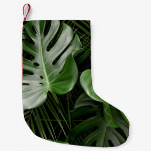 Monstera leaves, luxury tropical layout. small christmas stocking