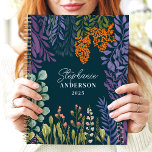 Moody Tropical Botanical Floral Custom Name Planner<br><div class="desc">This beautiful design features a lush botanical arrangement of vibrant foliage and florals in shades of purple, orange, green, and cream, set against a rich teal background. The personalised name and year add a refined touch, making it perfect for students, professionals, or nature enthusiasts. Ideal for organising daily tasks, journalling,...</div>