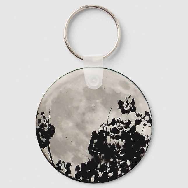 Moon behind dark leaves key ring (Front)