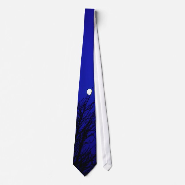 Moon in trees against deep blue sky tie (Front)