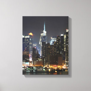 Moon rises over midtown New York. Canvas Print