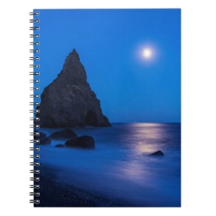 Moonrise reflection on ocean and sea stacks notebook