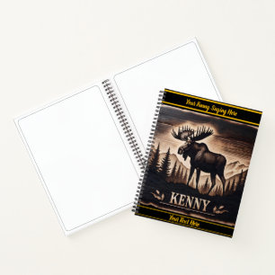 Moose carving in dark wood with backdrop notebook