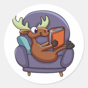 Moose reading a book on a sofa   choose back colou classic round sticker