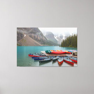 Moraine Lake Canoes Canvas Print