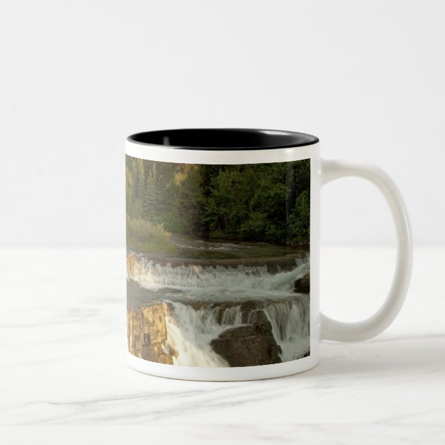 Morning light greets Swiftcurrent Falls in the Two-Tone Coffee Mug (Right)
