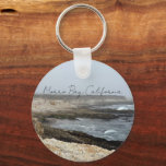Morro Bay California Coastal Photography Key Ring<br><div class="desc">A foggy overcast day in Morro Bay California with the ocean waves hitting the rocks on the shore in this beach photograph souvenir. This seaside travel photo keepsake keychain features black cursive script above the beach rocks and grey sky.</div>