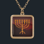 Moshe's Menorah Gold Plated Necklace<br><div class="desc">In the Torah Moshe Rabbenu is told, "You shall make a Menorah of pure gold, beaten out, shall the Menorah be made, its base, its branch, its goblets, its knobs, and its flowers shall be hammered from it, " [Shmot 25:31] and later, "See, and construct, according to their form that...</div>