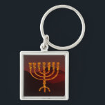 Moshe's Menorah Key Ring<br><div class="desc">In the Torah Moshe Rabbenu is told, "You shall make a Menorah of pure gold, beaten out, shall the Menorah be made, its base, its branch, its goblets, its knobs, and its flowers shall be hammered from it, " [Shmot 25:31] and later, "See, and construct, according to their form that...</div>