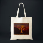 Moshe's Menorah Tote Bag<br><div class="desc">In the Torah Moshe Rabbenu is told, "You shall make a Menorah of pure gold, beaten out, shall the Menorah be made, its base, its branch, its goblets, its knobs, and its flowers shall be hammered from it, " [Shmot 25:31] and later, "See, and construct, according to their form that...</div>