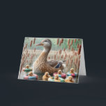 Mother Mallard Duck With Ducklings for Birthday Card<br><div class="desc">A serene pond scene features a mother mallard duck surrounded by her ducklings,  each nestled in colourful floating rings among tall cattails.
The inside text can be changed.</div>