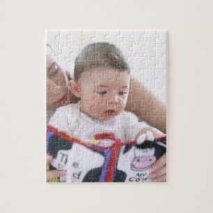 Mother reading to baby boy. Faces of a mother Jigsaw Puzzle