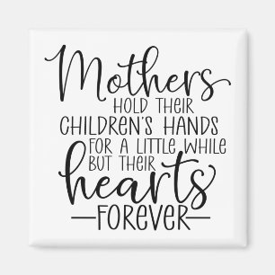Mothers hold their children's hand for a little wh magnet