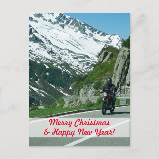 Motorcycle rider in snowy mountains Christmas Postcard (Front)