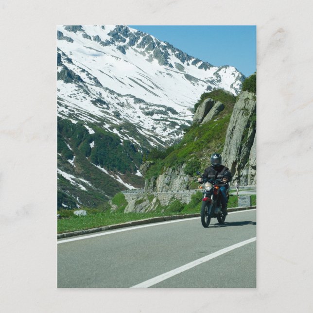 Motorcycle rider in snowy mountains photo postcard (Front)