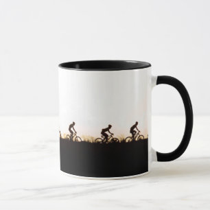Mountain Bike Riders Make Their Way Over The Dam Mug
