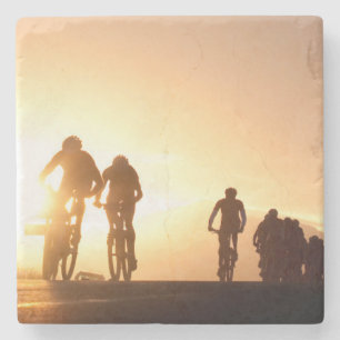 Mountain Bike Riders Make Their Way Over The Top Stone Coaster