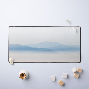 Mountains above clouds desk mat
