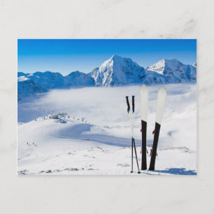 Mountains and ski equipment postcard