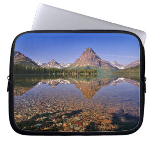 Mountains reflect into calm Two Medicine Lake in Laptop Sleeve