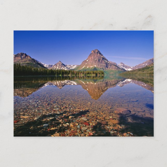 Mountains reflect into calm Two Medicine Lake in Postcard (Front)