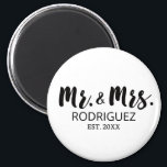 Mr and Mrs Modern Brush Font Wedding Gift Magnet<br><div class="desc">Celebrate the love and union of the bride and groom with our Mr. and Mrs. Modern Brush Font Wedding Gift Magnet. This elegant and minimalist magnet is the perfect wedding favour for guests. Featuring the "Mr." and "Mrs." titles in a stylish black and white brush font, it exudes a sense...</div>