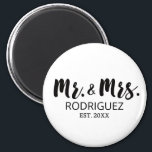 Mr and Mrs Modern Brush Font Wedding Gift Magnet<br><div class="desc">Celebrate the love and union of the bride and groom with our Mr. and Mrs. Modern Brush Font Wedding Gift Magnet. This elegant and minimalist magnet is the perfect wedding favour for guests. Featuring the "Mr." and "Mrs." titles in a stylish black and white brush font, it exudes a sense...</div>