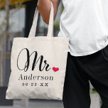 Mr. Black Script Married Monogram Wedding Tote Bag<br><div class="desc">Personalised tote bags for the newly married Mr. and Mrs. feature elegant black script and custom last name and wedding date monogram text that can be personalised. Design includes a cute red heart detail. Makes a great wedding gift! Shop our store for the coordinating Mrs. bag design.</div>
