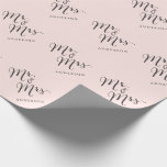 Mr & Mrs Classic Script Calligraphy Name Wedding Wrapping Paper<br><div class="desc">A modern classic and simple 'Mr. and Mrs.' black calligraphy script design with names that can be personalised, on a sweet pastel blush pink background. This custom wrapping paper is great for wedding favours, wedding parties, engagement and couples showers. The base background can be changed to any colour of your...</div>