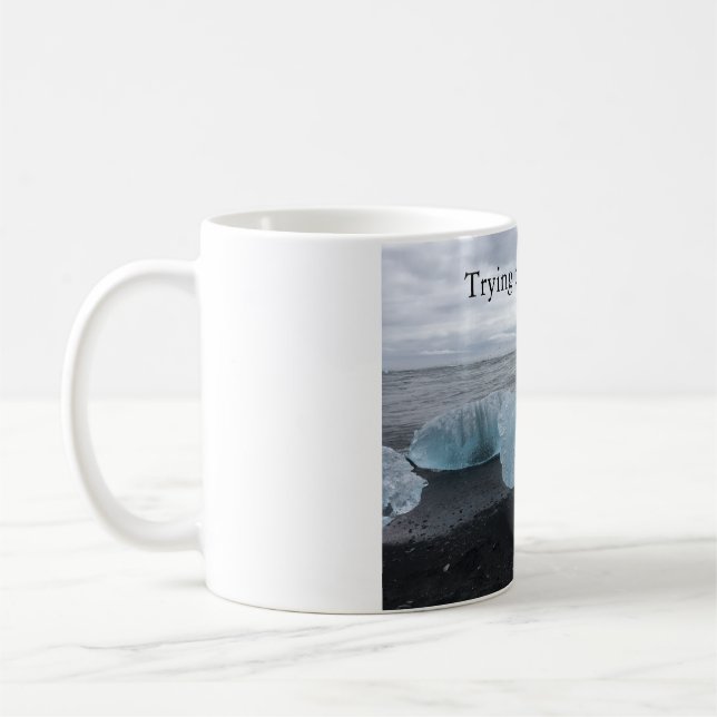Mug with ice on black beach  (Left)