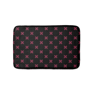 Mulberry cross stitches on black bath mat