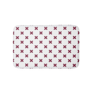 Mulberry cross stitches on white bath mat