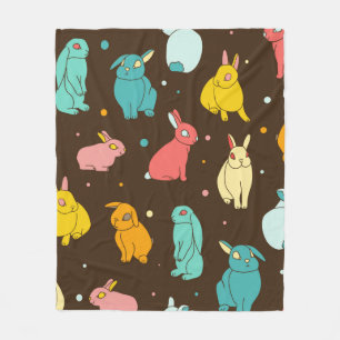 Multi-colored, different rabbits, hares on a dark fleece blanket