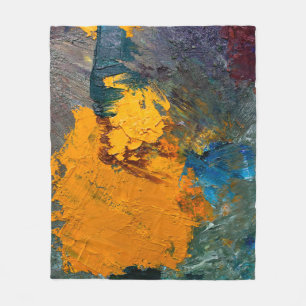multi-colored strokes of oil paint on the artist's fleece blanket