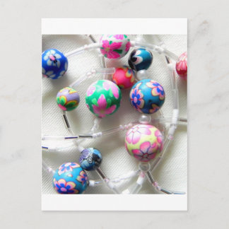 multi coloured beaded necklace postcard