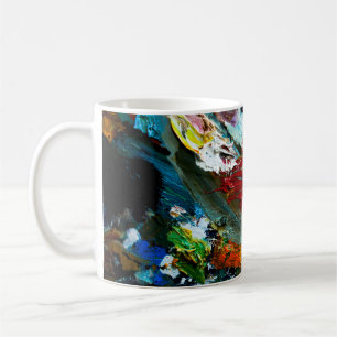 multi-coloured strokes of oil paint on the artist' coffee mug