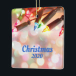 Multi-coloured Twinkle Light, Christmas 2020 Ceramic Ornament<br><div class="desc">Multi-coloured Twinkle Light, Christmas 2020 Ceramic Ornament - Multi-coloured Twinkle Lights, with a beautiful boken of lights shining all around with Christmas 2020 as the message. This is completely customisable and can be changed to anything you'd like. On the back is a place for your own photo. Happy Holidays and...</div>