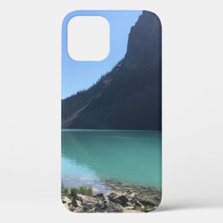 MULTICOLORED CANOES MOORED IN DOCK IN LAKE iPhone 12 CASE