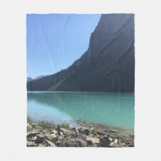 MULTICOLORED CANOES MOORED IN DOCK IN LAKE FLEECE BLANKET