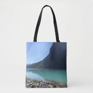 MULTICOLORED CANOES MOORED IN DOCK IN LAKE TOTE BAG