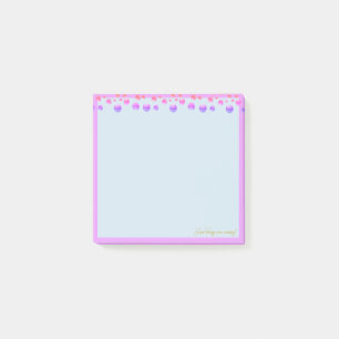 Multicolored confetti on light blue post-it notes