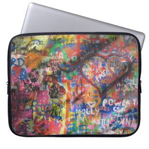 Multicolored graffiti on concrete wall laptop sleeve