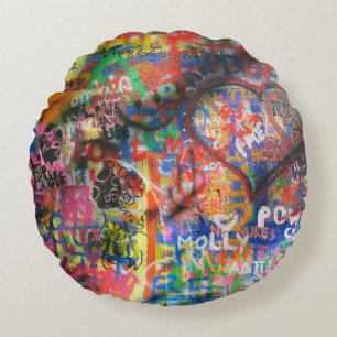 Multicolored graffiti on concrete wall round cushion