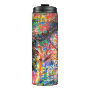 Multicolored graffiti on concrete wall thermal tumbler