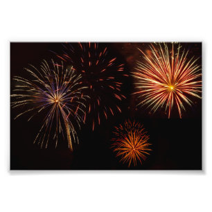 Multiple bursts of fireworks against black photo print