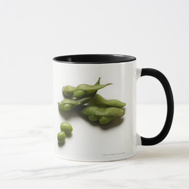 multiple green edamame beans with pea pod broken mug (Right)