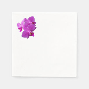 Multiple purple orchids on  napkin