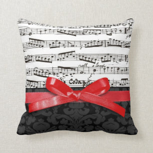 Music notes and faux red ribbon cushion