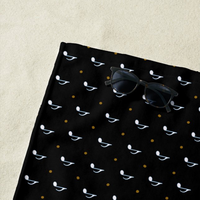 music notes on black beach towel (In Situ)