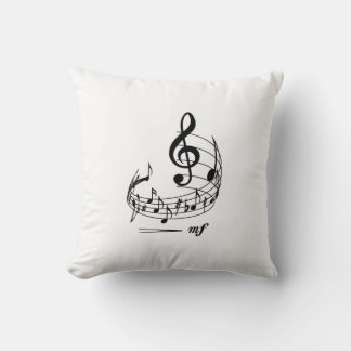 Music notes with treble clef on staff cushion